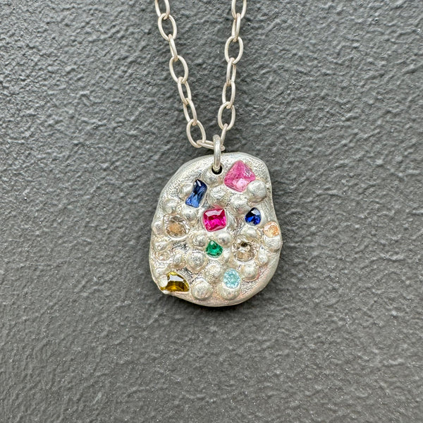 Intoxicating - Silver and synthetic sapphire emerald pendant necklace
