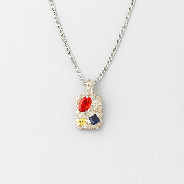 Necklace with a pendant featuring colorful gemstones on a white background