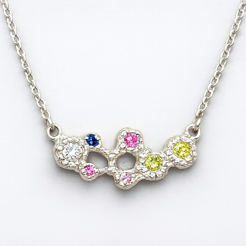 Necklace with colorful gemstones on a white background